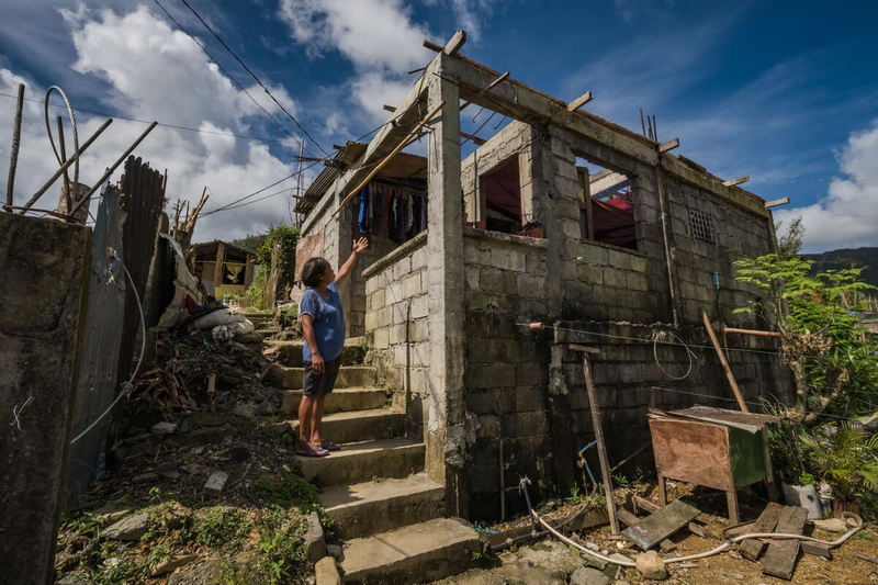 Rosalie Triste, who is 47 years old, points out the areas of damages in her home in San Miguel, Catanduanes, on 15 December 2020. WFP is providing support to local communities in Catanduanes, Philippines, following the devastating effects of Typhoon Goni. Photo: WFP/Arete/Angelo Mendoza.